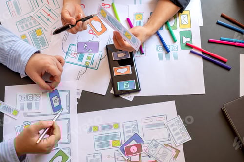 Preview: Mobile application designers plan together in the office.