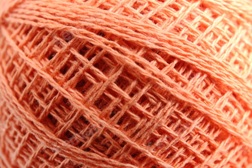 Preview: Clew of knitting threads as background, top view. Sewing stuff