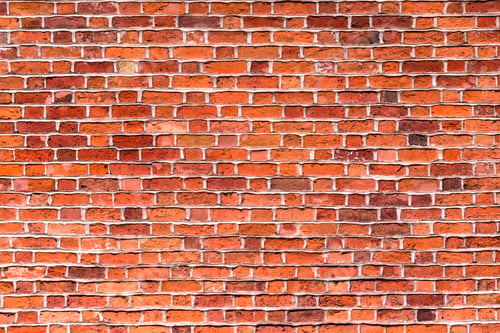 Preview: Natural old vintage weathered red brown solid brick wall. Abstract copy space background.