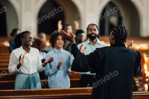 Preview: African american preacher leading congregation in prayer