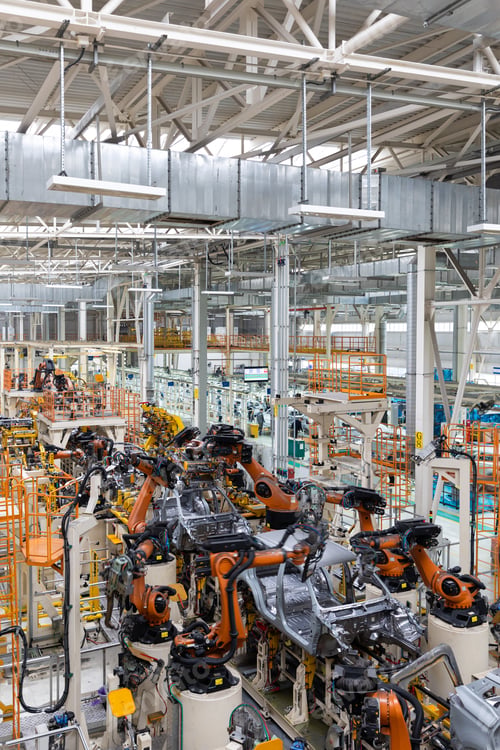 Preview: Vertical photo of automobile production line. Modern car assembly plant. Auto industry. Interior of