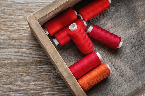 Preview: Wooden box with color sewing threads, closeup
