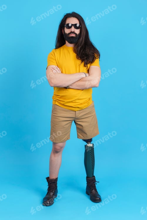 Preview: Rude man with a leg prosthesis looking at camera