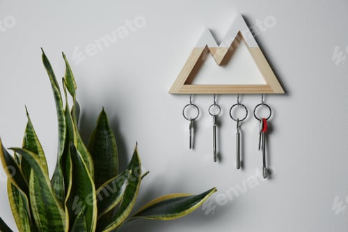 Preview: Wooden key holder on light wall indoors