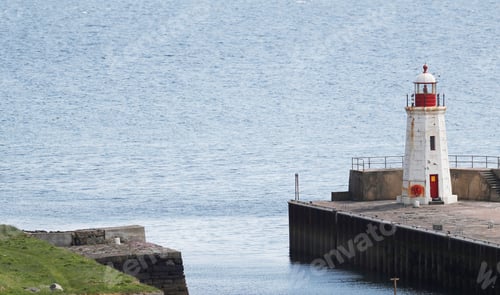 Preview: Captivating lighthouse at the end of a picturesque dock in the Lybster Harbour, Scotland