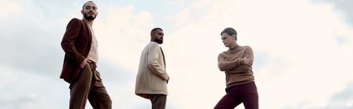Preview: Stylish men showcase autumn fashion while posing gracefully in a serene field setting