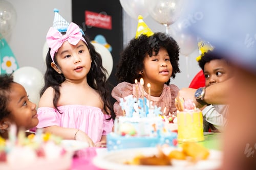 Preview: Group of little kids in party hat with birthday cake