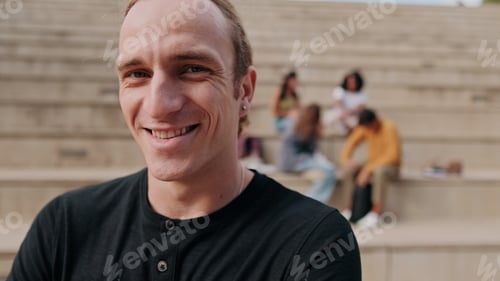 Preview: Smiling Man With Friends On Outdoor Steps