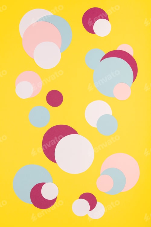 Preview: Colorful paper circles on yellow paper background