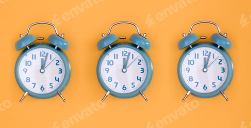 Preview: Blue alarm clocks on orange background isolated, flat lay.
