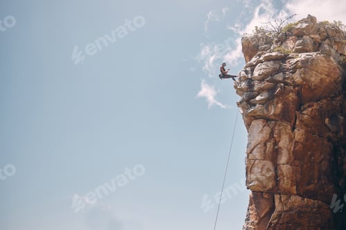 Preview: Mockup blue sky, mountain climbing woman and rock wall fearless hiking on abseiling training rope o