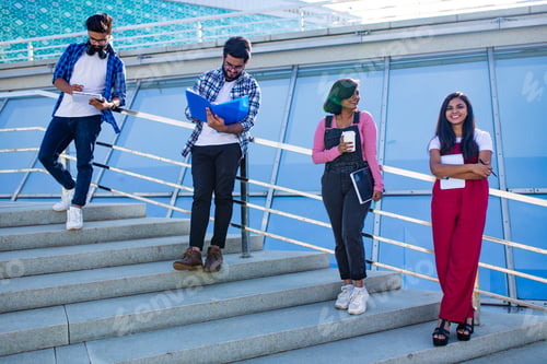 Preview: indian students keeping distance and do home work outdoors