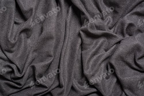 Preview: Background of grey folds fabric texture. Grey textile. Top view.
