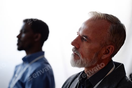 Preview: Senior Man Attending Business Conference in Lecture Room