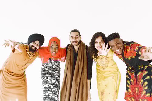 Preview: Group of diverse smiling men wearing in folk costumes