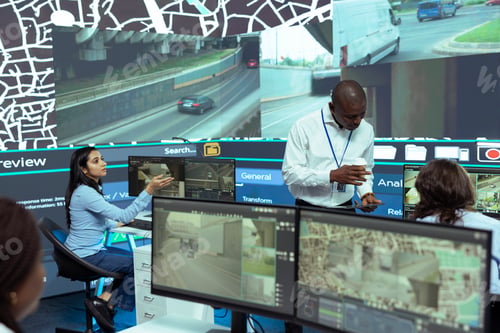 Preview: African american team leader supervising shipment activity in monitoring room