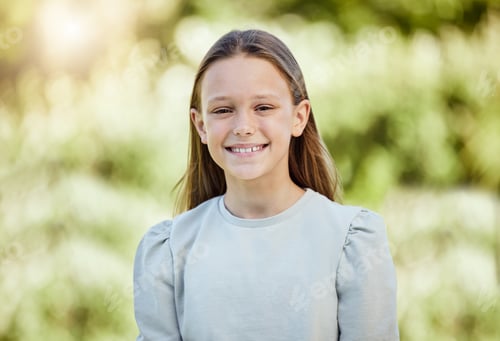 Preview: Just smile. Shot of an adorable little girl standing outside.
