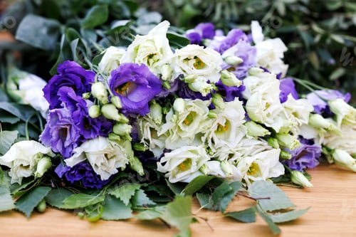 Preview: bouquet eustoma on the table in the cafe