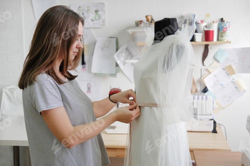 Preview: Female Tailor Working In In The Sewing Workshop.