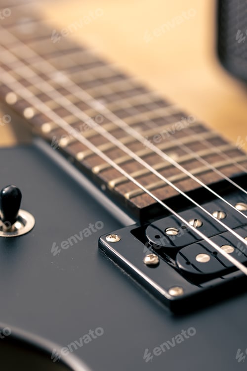 Preview: Photo of details of an electric guitar close up.