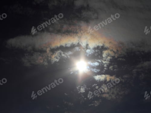 Preview: Sun Shining Brightly In An Afternoon Sky With Iridescent Clouds - Photograph Of An Afternoon Sun