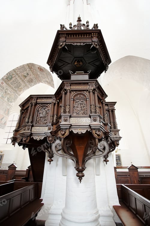 Preview: The inside of a beautifully designed cathedral - intricate wood carvings around a pillar