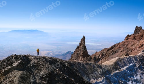 Preview: Hiker ascending top of volcanic mountain