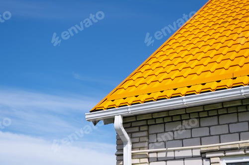Preview: Rain Gutter Pipeline System on brick house , bright yellow metal tile roof
