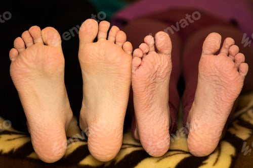 Preview: Close-up of children wrinkled feet after long bath