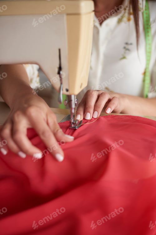 Preview: Tailor working at her workshop
