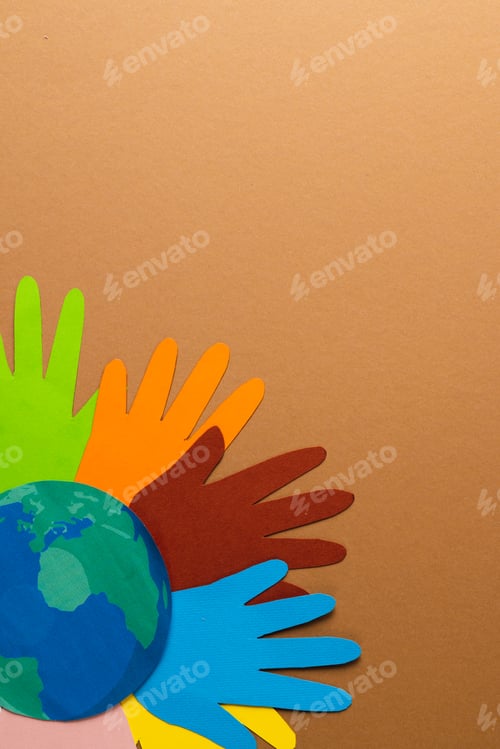 Preview: Paper cut out of multi coloured hands and globe with copy space on brown background