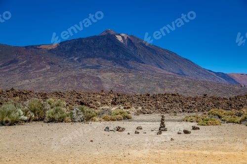 Preview: Majestic view of Mount Teide in Tenerife, surrounded by volcanic landscape and sparse vegetation