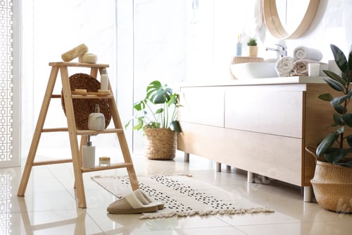 Preview: Dispensers and different toiletries on decorative ladder in bathroom. Idea for interior design