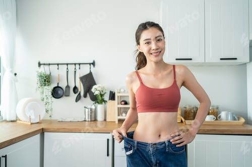 Preview: Asian beautiful woman feel happy after lose weight for health in house.