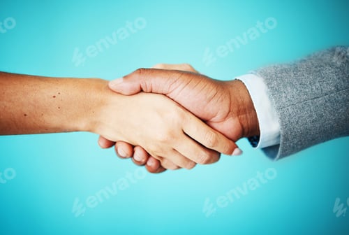 Preview: Cropped shot of two unrecognisable businesspeople standing together in the office and shaking hands