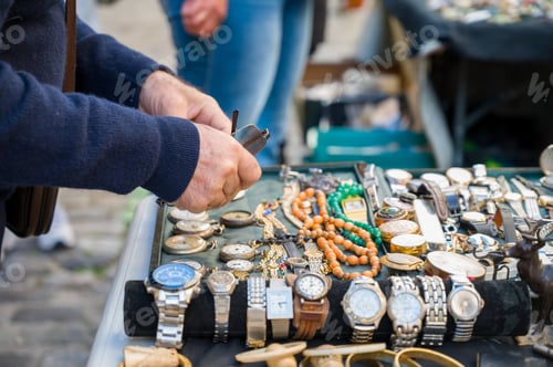 Preview: A person looking for some deals in a flea market