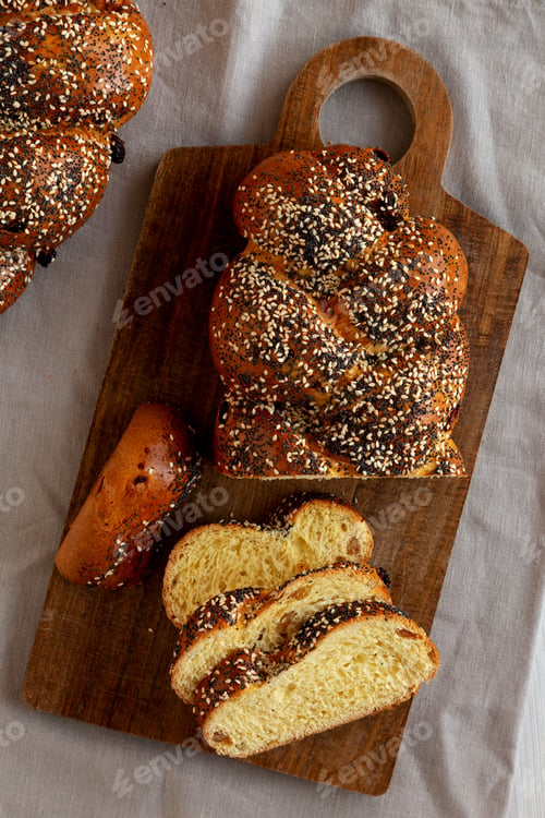 Preview: Homemade Challah Bread covered with Poppy and Sesame Seeds, top view.