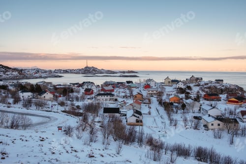 Preview: Colorful Norwegian village with snow covered on coastline in winter at boundary of Lofoten islands