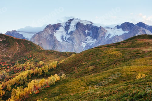 Preview: Autumn landscape and snowy mountain peaks. View of the