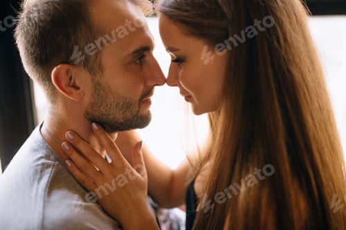 Preview: A couple in love facing each other in close-up