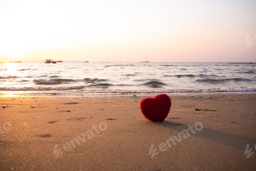 Preview: Heart shape on sand beach at coast