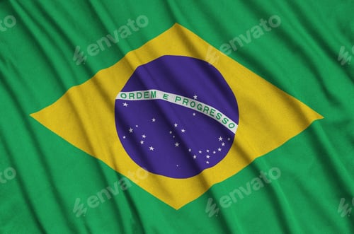 Preview: Brazil flag is depicted on a sports cloth fabric with many folds. Sport team waving banner