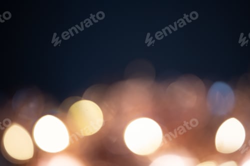 Preview: Blurred Christmas lights over dark blue background