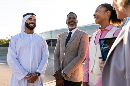 Preview: Group of multiethnic business people meeting an emirati businessman