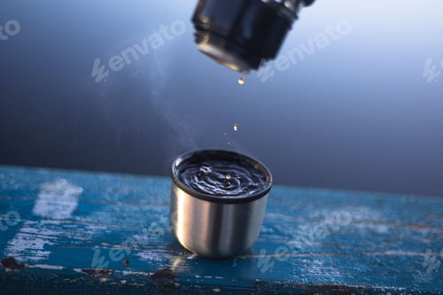 Preview: Closeup shot of pouring coffee from a thermos to thermos cup