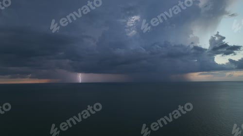Preview: Dark weather front clouds forming on stormy sky during heavy rainfall season over sea