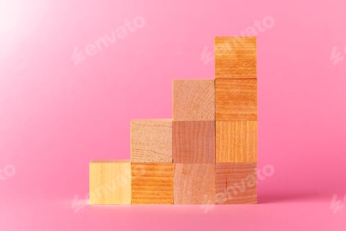 Preview: Toy wooden cubes with copy space against pink background