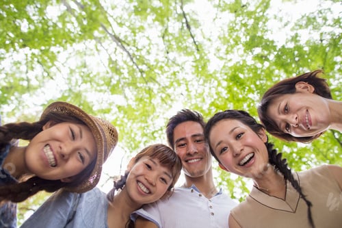 Preview: Group of friends at an outdoor party in a forest.