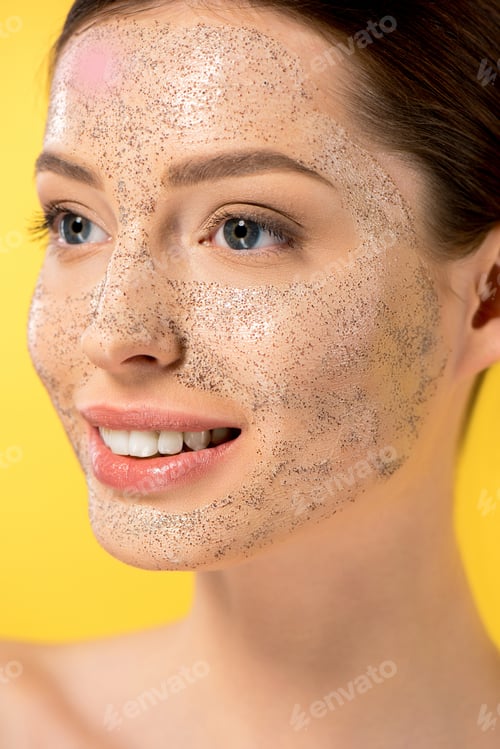 Preview: portrait of positive girl with peeling mask, isolated on yellow