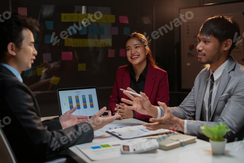 Preview: Team of business people are having a late night meeting in the office